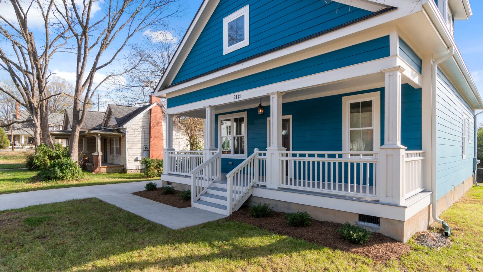 A Southern craftsman home raised on a foundation with visible crawlspace vents